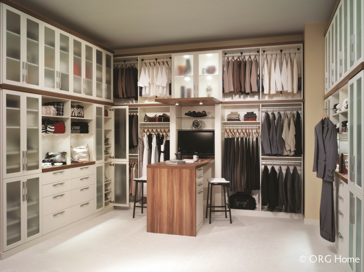 custom closet design with drawers doors and counter space colulmbus