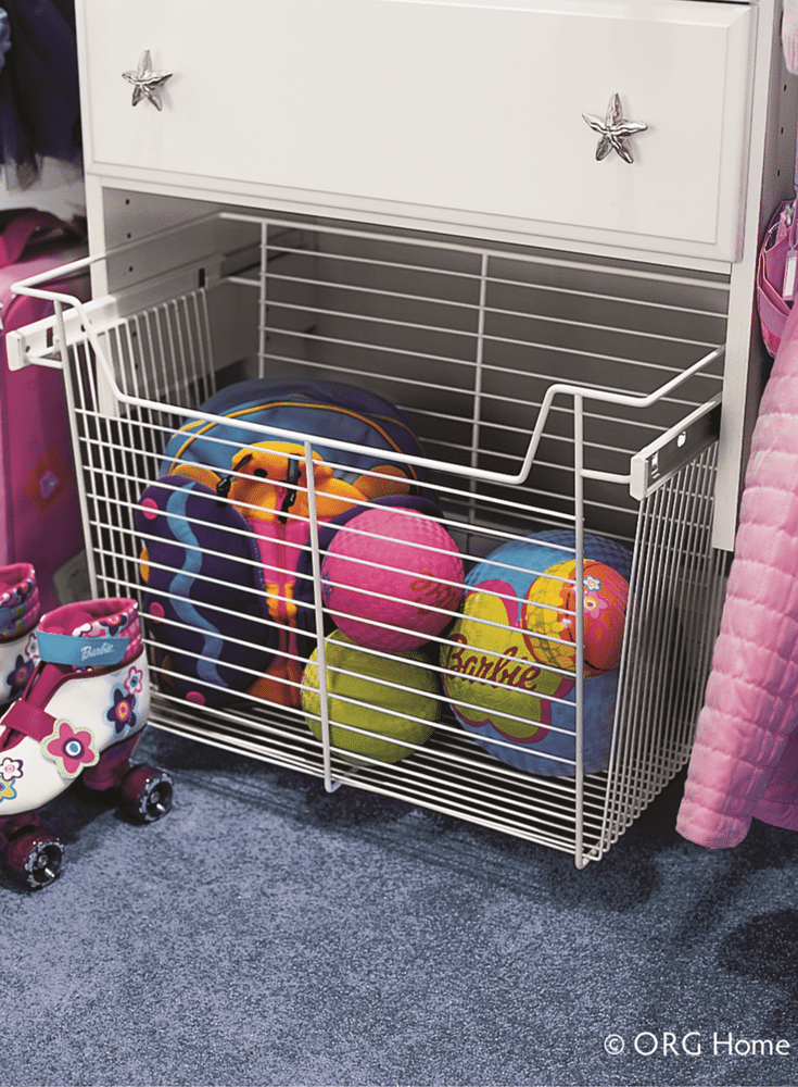 Closet pull out baskets for storage of balls and games for a kids closet in Columbus Ohio. 