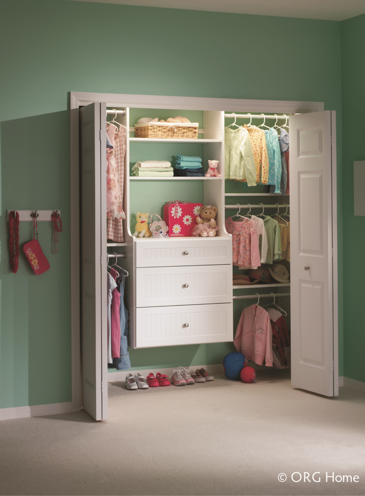 A custom nursery closet with 3 clothing rods to maximize the storage for the baby. 