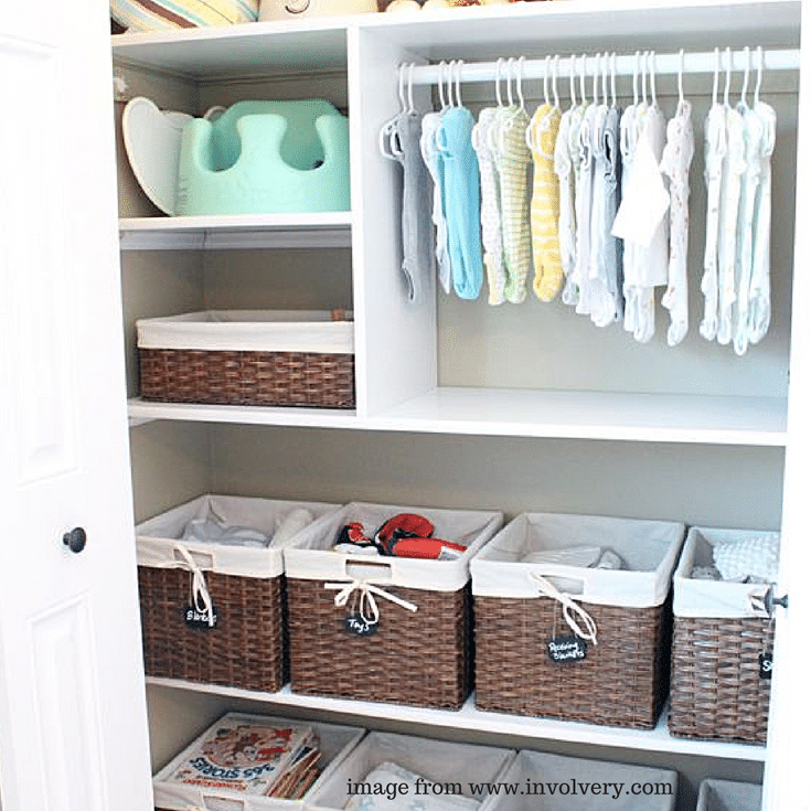 Wicker baskets provide a decorative way to store supplies in this baby nursery closet.