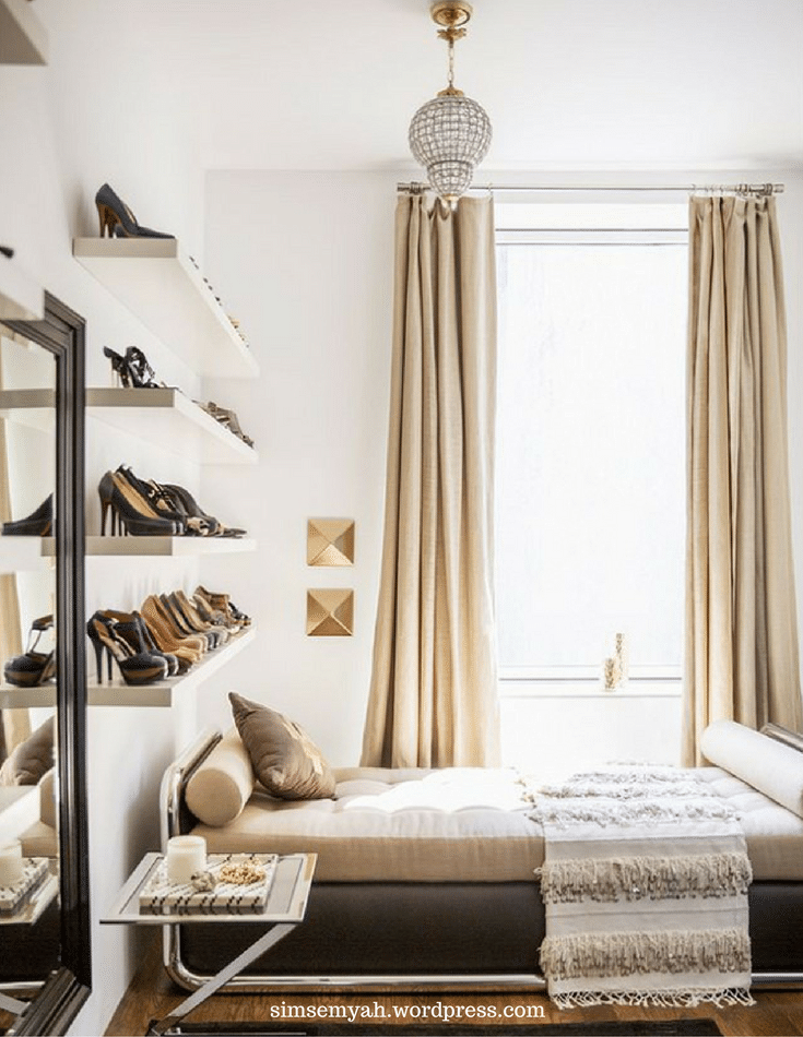 Display shelves of shoes in a luxury bedroom where closet space is limited