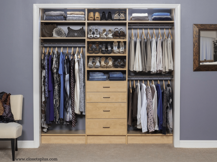 Womans reach in closet in Columbus witwh drawers and double hanging sections - Innovate Home Org