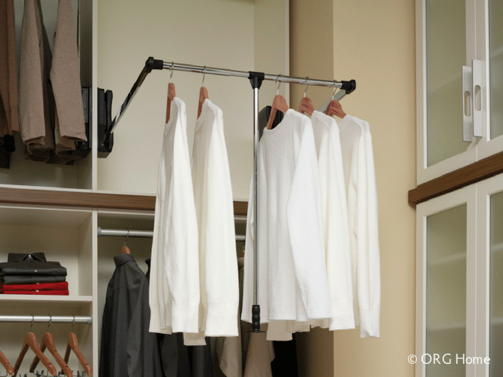 Pull down shelves in a custom closet | Innovate Building Solutions