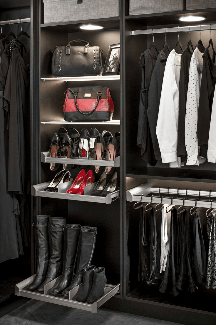 Contemporary slide out boot storage tray in a walk in custom bedroom closet | Innovate Home Org Columbus Ohio 