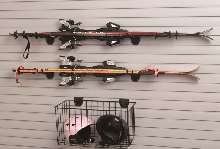 This hanging garage storage and pegboard system is a convenient place for ski poles, rakes, shovels and other things you want to get off the garage floor. | Innovate Home Org Columbus Ohio 