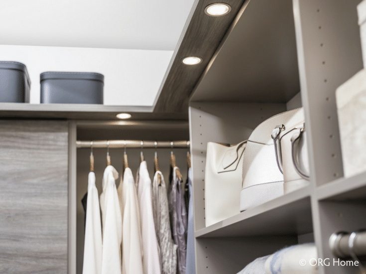 Puck LED lighting on the underside of a custom closet shelving system | Innovate Home Org Columbus Ohio