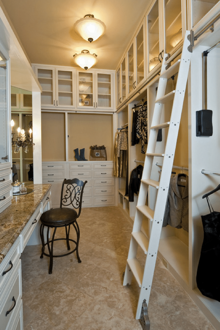 A traditional library ladder allows this owner to use height in a custom walk in luxury bedroom closet | Innovate Home Org Columbus Ohio 