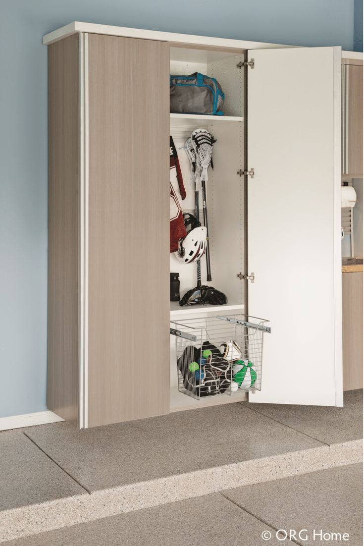 Slide out basket in a garage cabinetry system with a place for sporting goods and balls | Innovate Home Org Columbus Ohio