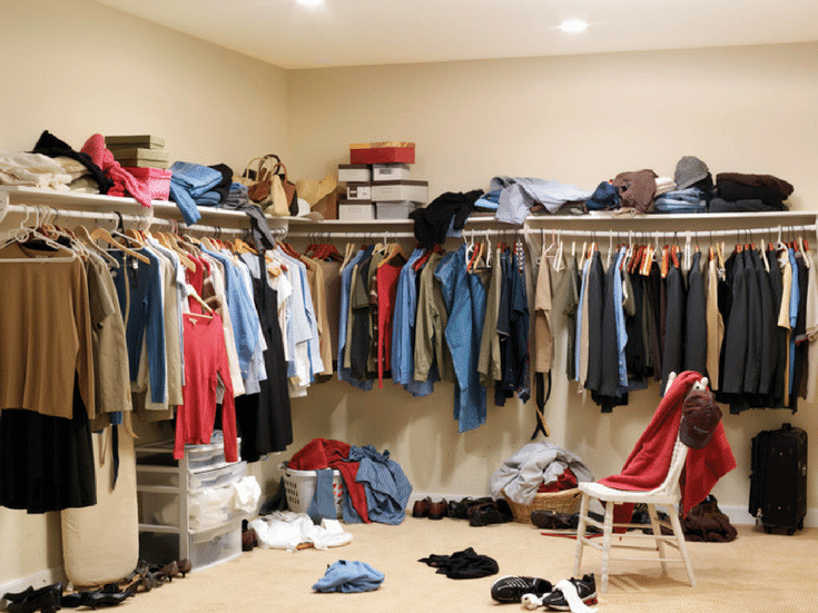 A cluttered columbus closet with too much hanging space |Before picture - Innovate Home Org 
