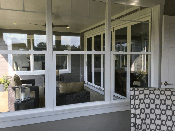 sliding glass doors in a covered outdoor patio bia parade of homes from Maple Craft Custom Builders 