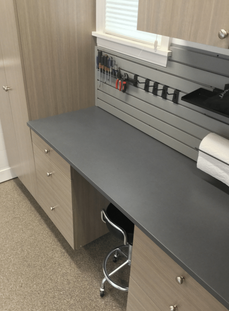 Garage workbench with gray slatwall for tool and hooks in columbus | Innovate Home Org Columbus Ohio