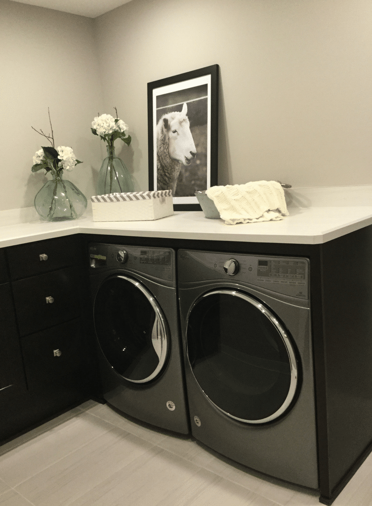 Second floor laundry with a countertop in the 2017 Columbus BIA Parade of Homes for folding and sorting in the Manor Parade Home - Innovate Home Org 