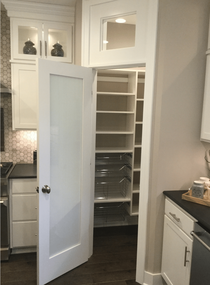 Sliding pantry storage baskets in a chrome finish for an easy to use custom pantry. This was displayed at the Columbus 2017 Building Industry Parade of Homes - Innovate Home Org 
