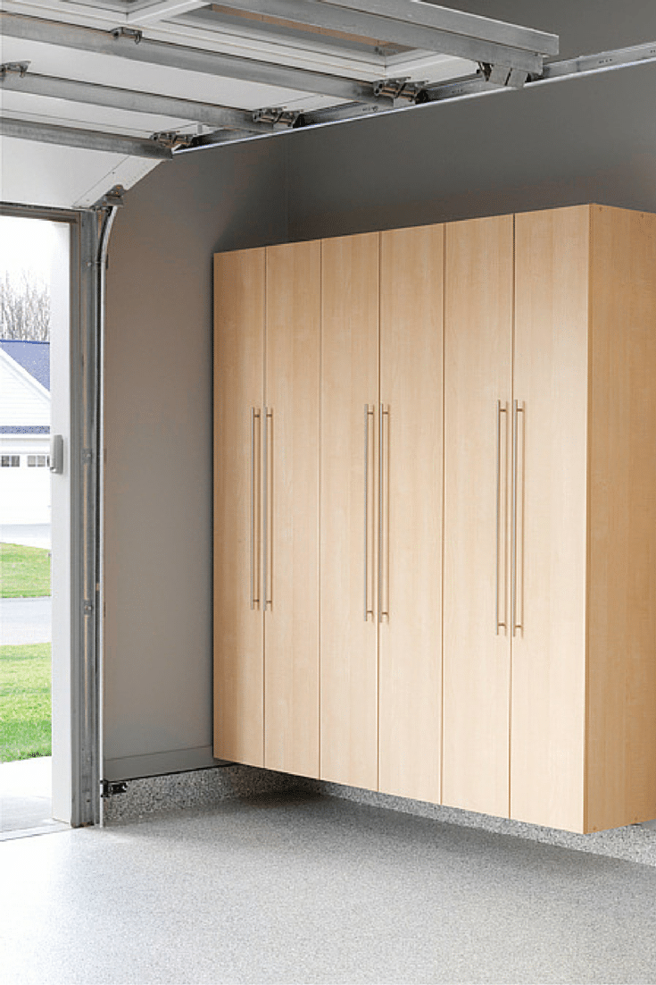 Cabinets by the garage doors for sporting goods and rakes and broom storage Innovate Home Org Columbus and Cleveland Ohio