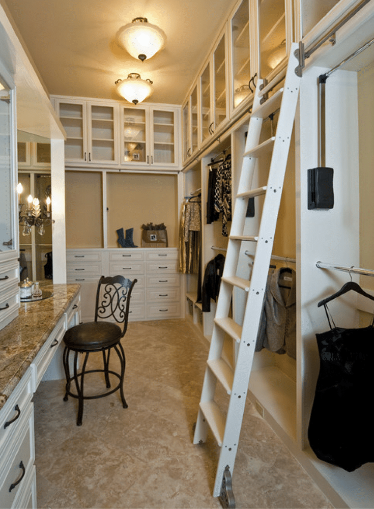 rolling library ladder in a custom closet space 