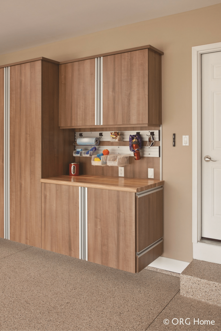 Workbench and custom garage cabinetry for improved storage in a 55+ community. Innovate Home Org Columbus Ohio 