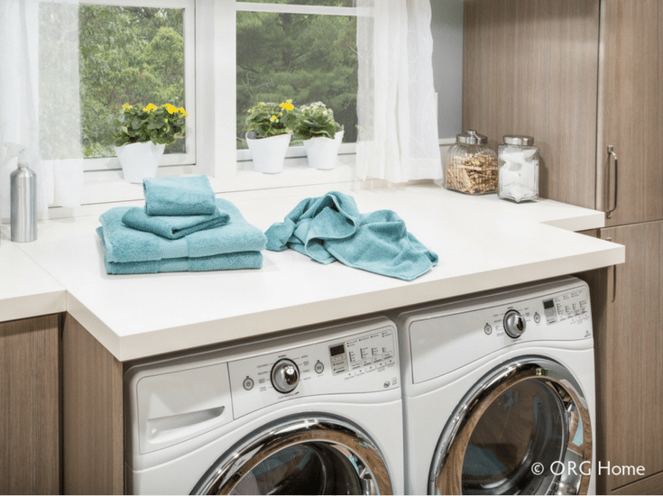 Laundry room counter above a washer and dryer for work space - Innovate Home Org Columbus Ohio