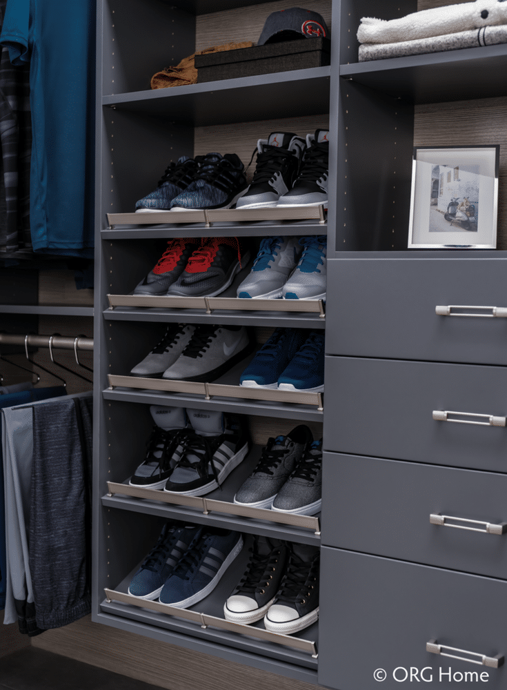 The sleek minimalist look is in. Love this men's custom closet system in a darker color  - simple, yet elegant. | Innovate Home Org Columbus Ohio
