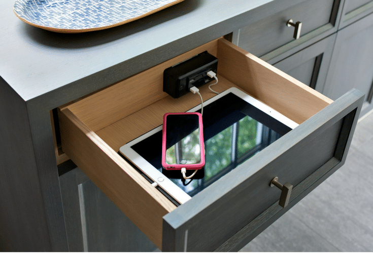 Inside drawer closet charging station is sleek and functional in this luxury walk in bedroom closet in Columbus Ohio | Innovate Home Org 