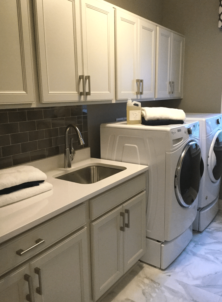 A long laundry room counter makes laundry day (and sorting and folding) simpler. This one in Galena Ohio makes laundry day less of a hassle. - Innovate Home Org Columbus Ohio