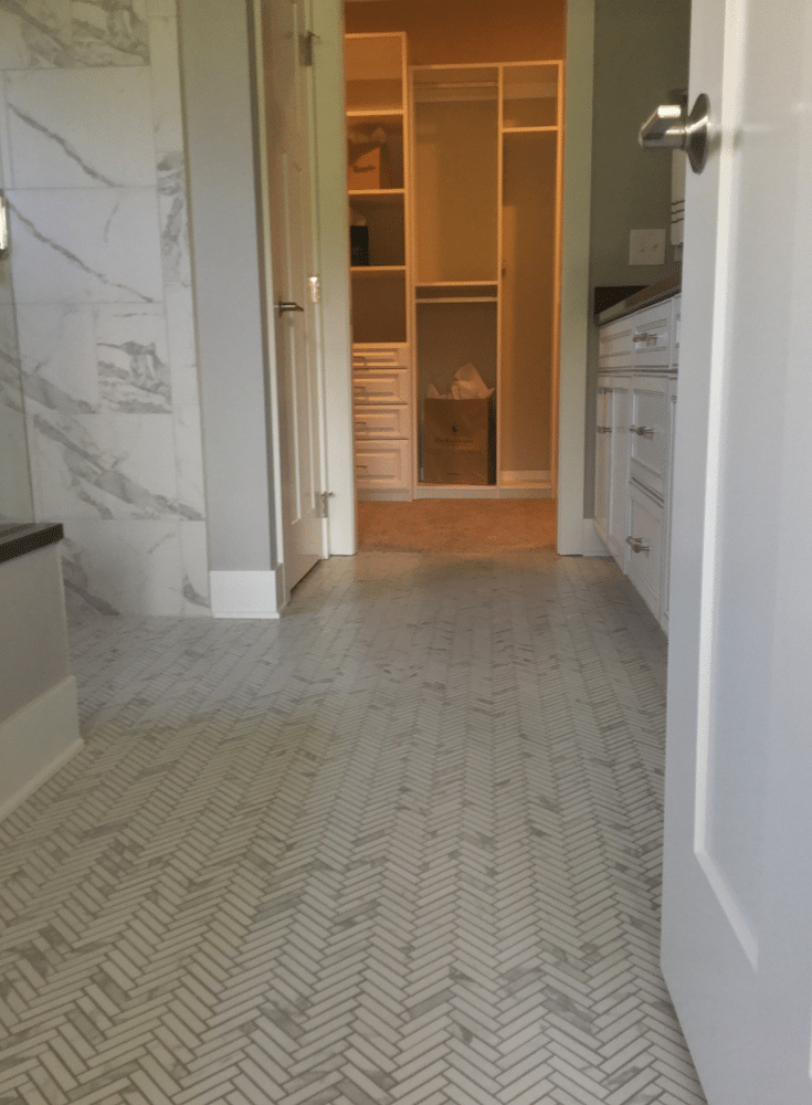 This upscale master bathroom leads into a luxury master his and hers closet in the BIA Parade of Homes in Columbus - Innovate Home Org Columbus Ohio 