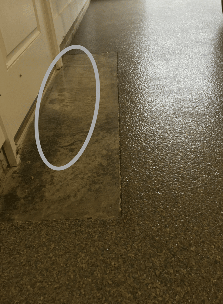 Handprints in garage concrete floor