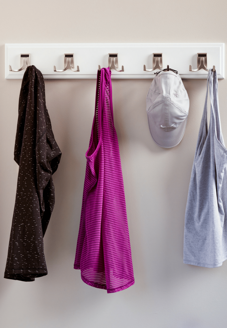 Hookboard to get better usage out of a thin closet wall | Innovate Home Org | #HangingSpace #SmallWalkInCloset #HookboardCloset