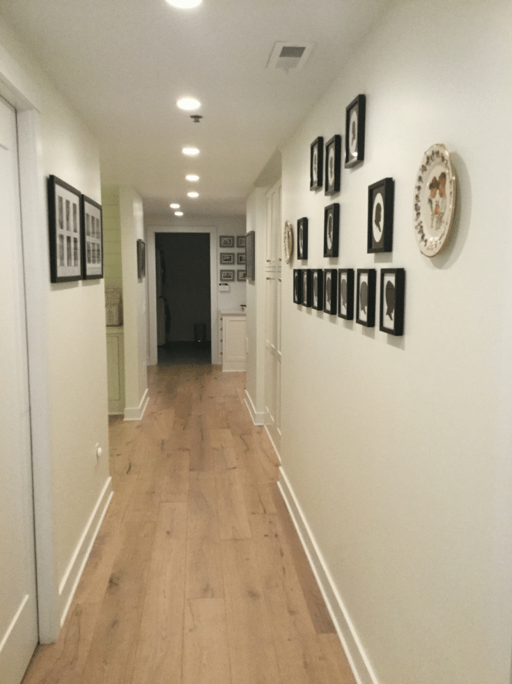 Consistent light beige walls with black framed photos | Innovate Home Org | Dublin Home | #SimpleHome #DreamHome #Hallways