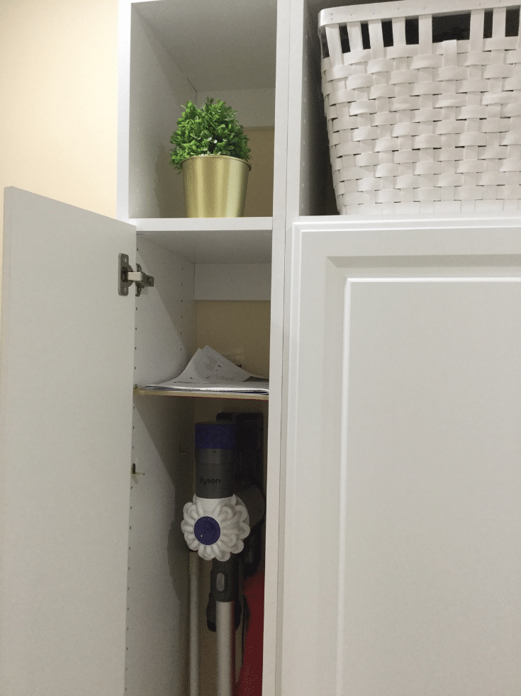 Narrow cabinet with Dyson vaccuum in a bexley mudroom | Innovate Home Org | #NarrowCabinets #ClosedCubbies #EntryWayStorage