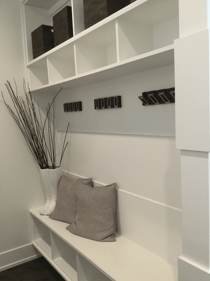 Minimalist contemporary mudroom storage hooks in Romanelli and Hughes home | Innovate Home Org | #MudroomStorage #ContemporaryMudroom #StorageHooks