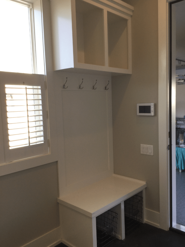 Small mudroom open cubby system in a Parade home | Innovate Home Org | #SmallMudroom #OpenCubbies #MudroomOptions