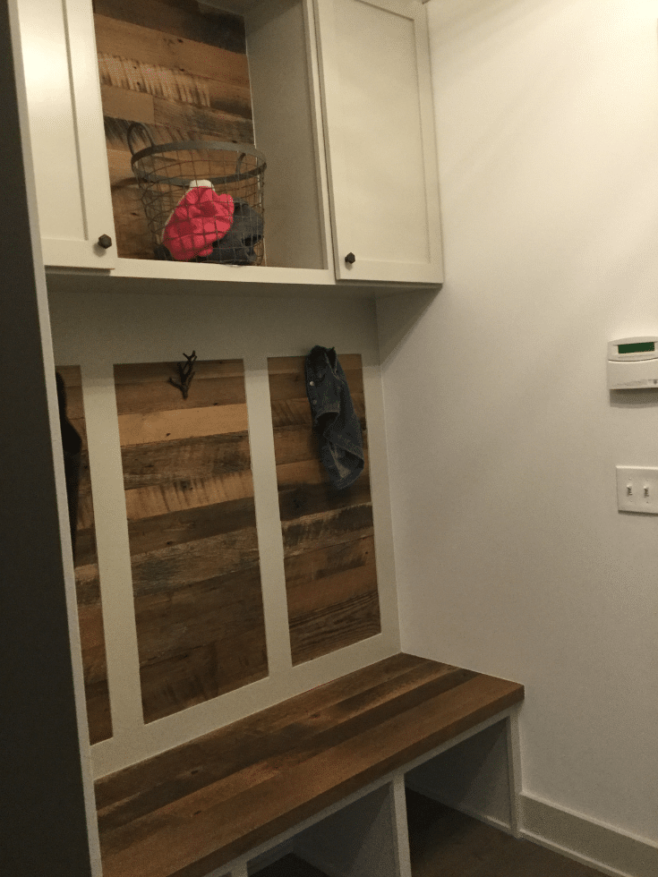 Wood feature wall in an entryway system in Columbus | Innovate Home Org | #WoodCabinets #MudroomIdeas #EntrywayIdeas