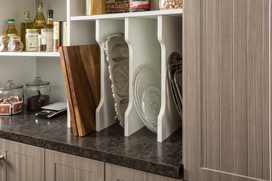 vertical cookie sheet organizer in a columbus ohio pantry shelving system | Innovate Home Org | #CustomStorage #OrganizationSolutions #PantryStorage #VerticalOrganizer #CookieSheet