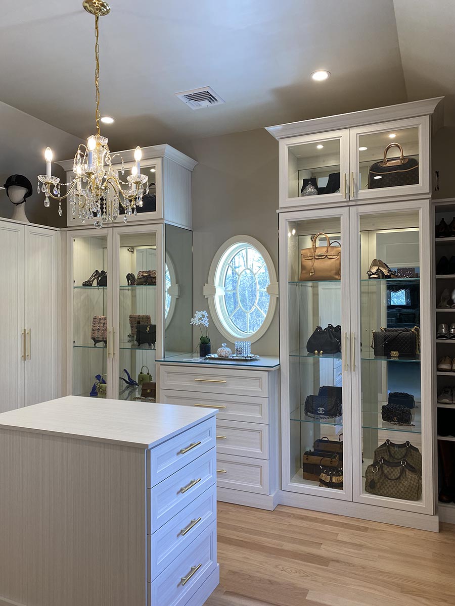 Idea 2 a feature closet wall with glass doors mirrored backs credit Patty Miller Boutique Closets and Cabinetry | Innovate Home Org | Columbus, OH Dublin, OH | #CustomStorage #HomeOrganization #beautifulclosets #DesignerCloset