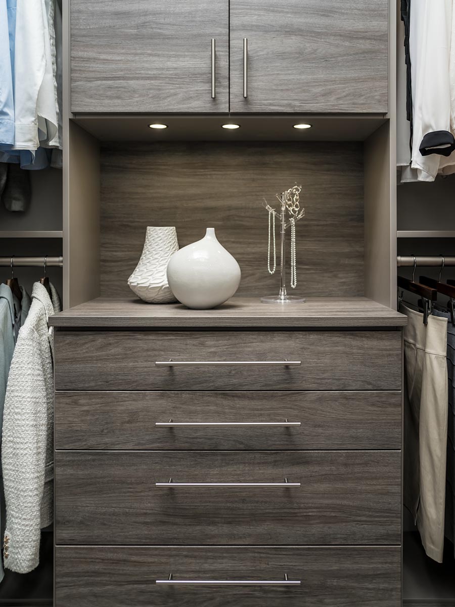 Pro 3 focal point in a closet system drawers with a custom back panel | Innovate Home Org | #Closetdesign #customstorage #walkincloset