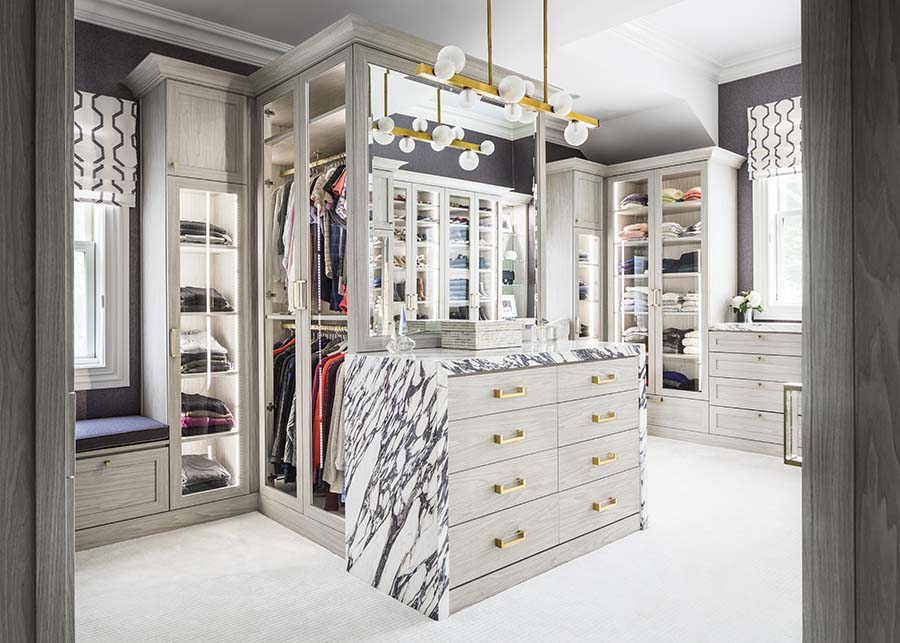 Trick 5 high end luxury closet with glass doors with shoes handbags credit Patty Miller Boutique Closets and Cabinetry | Innovate Home Org #CustomStorage #LuxuryCloset #OrganizationSolutions