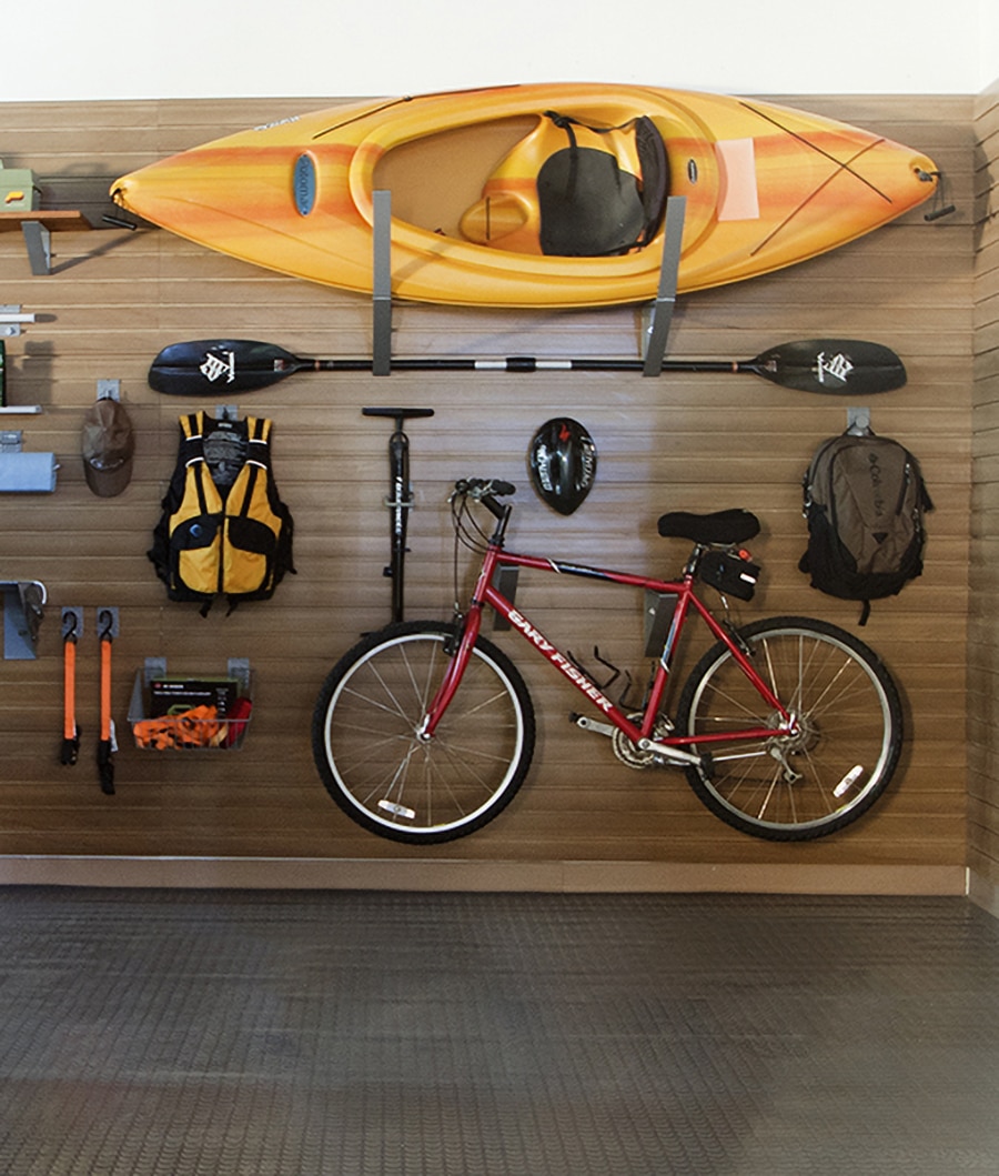 Step 7 sporting good and Kayak storage in a Dublin Columbus ohio garage organization system | Innovate Home Org #StoageSystems #HomeOrganization #Slatwall