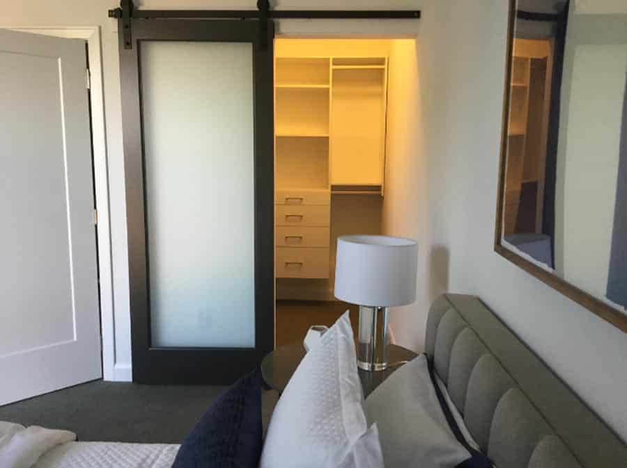 Trick 8 sliding barn door in downtown columbus walk in closet | Innovate home org | Custom Closet Storage Organization | Columbus, OH Closet 