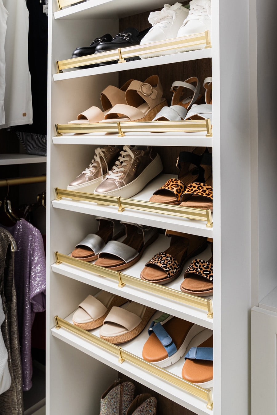 Idea 13 - Raised shoe shelves with a brushed gold bars Timeless Closets - Innovate Home Org, Upper Arlington Closet Systems, Custom Closet Storage Ideas, Modern Home Storage Needs, Luxury Home Closet Concepts